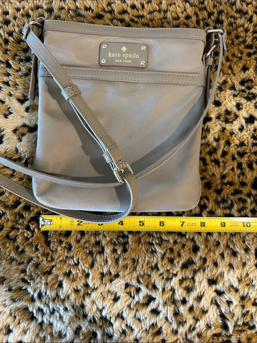 kate spade khaki-green crossbody bag with gold plaque